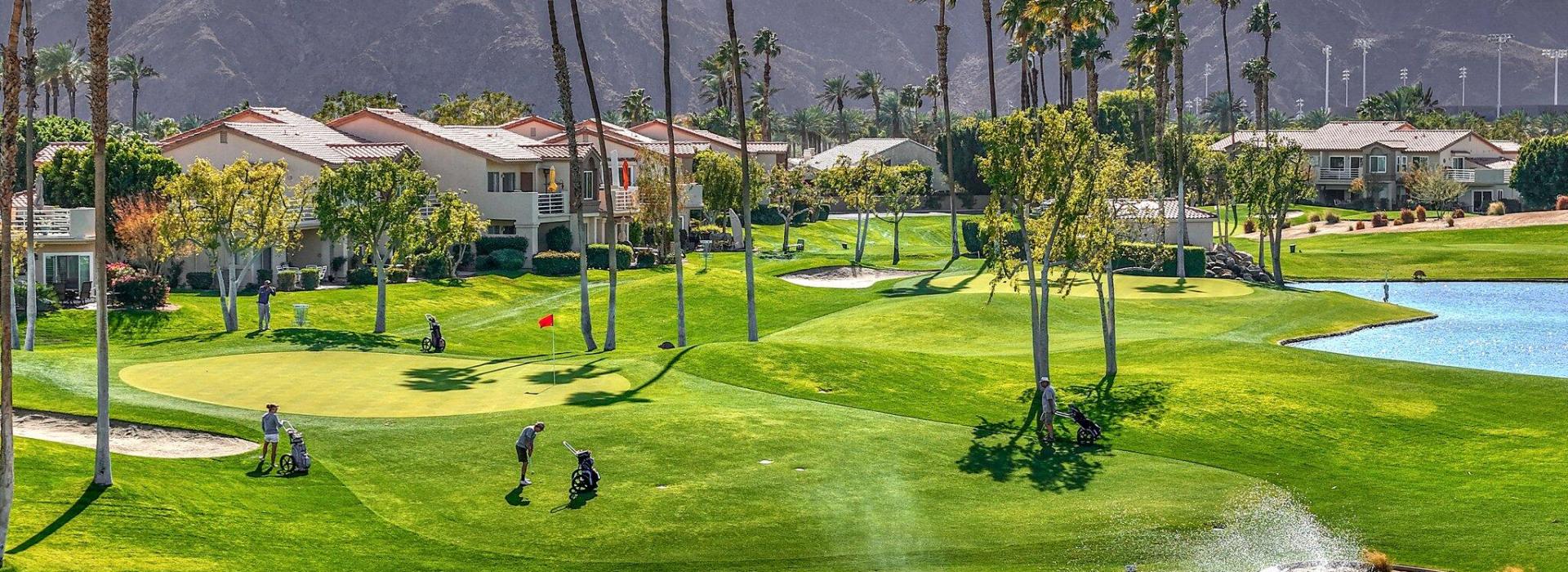 Golf course fairway with mountains in distance